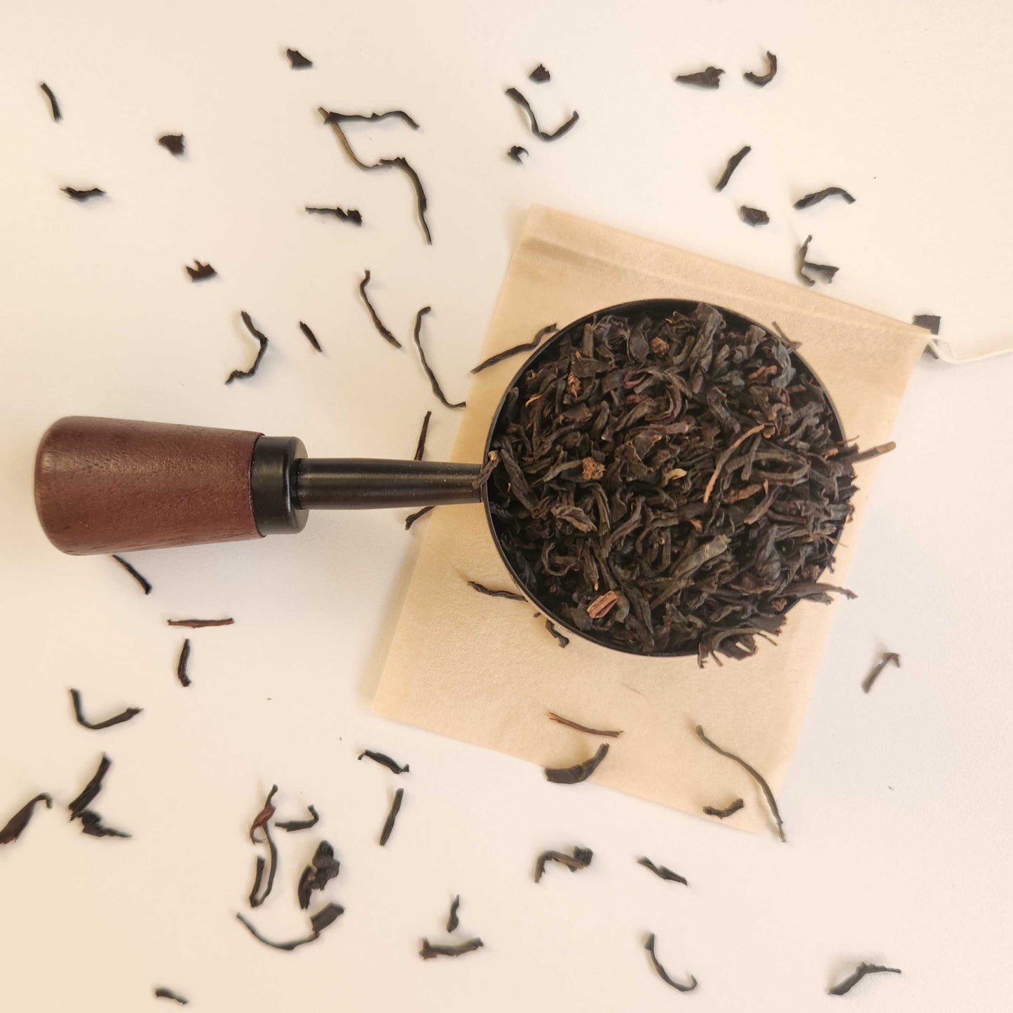 Monimo biodegradable and home compostable eco-friendly teabag pictured with Premium English Breakfast black tea.