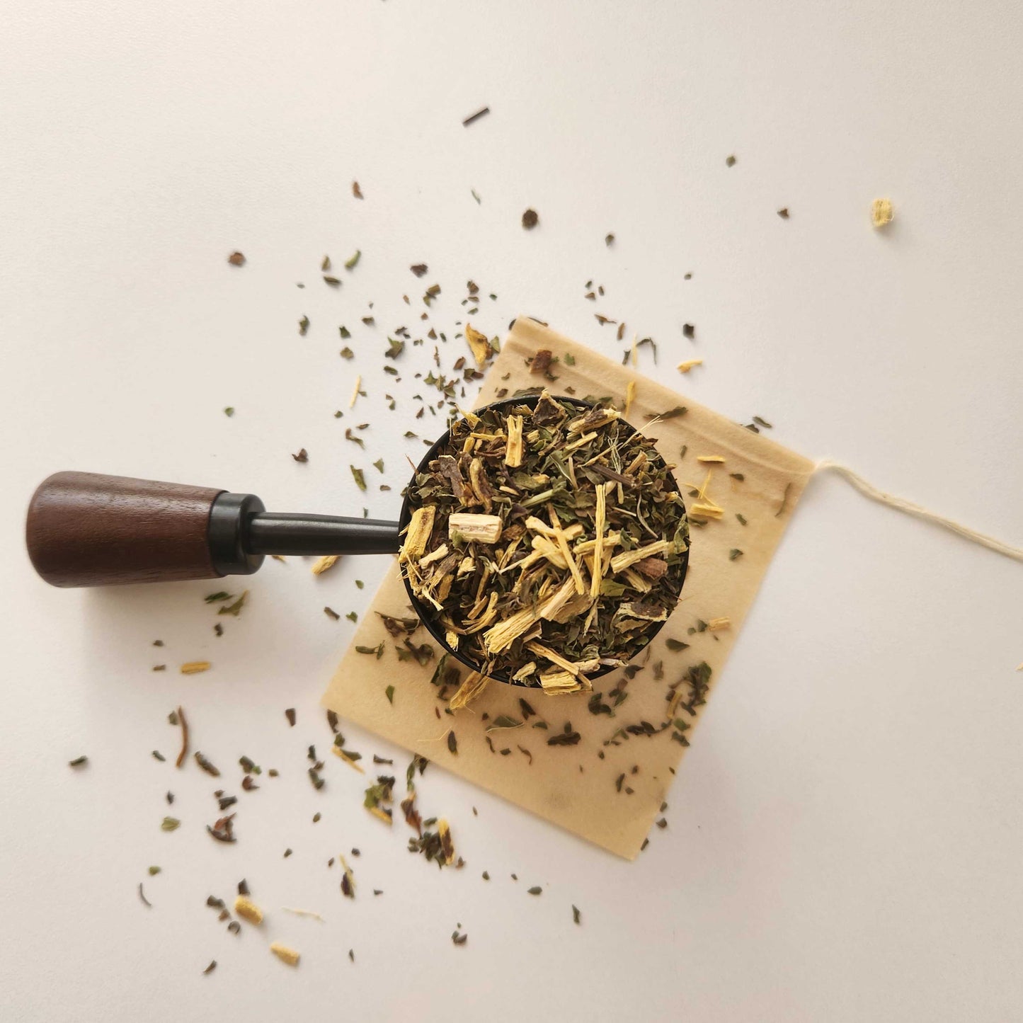 Monimo biodegradable and home compostable eco-friendly teabag pictured with licorice and mint tea.