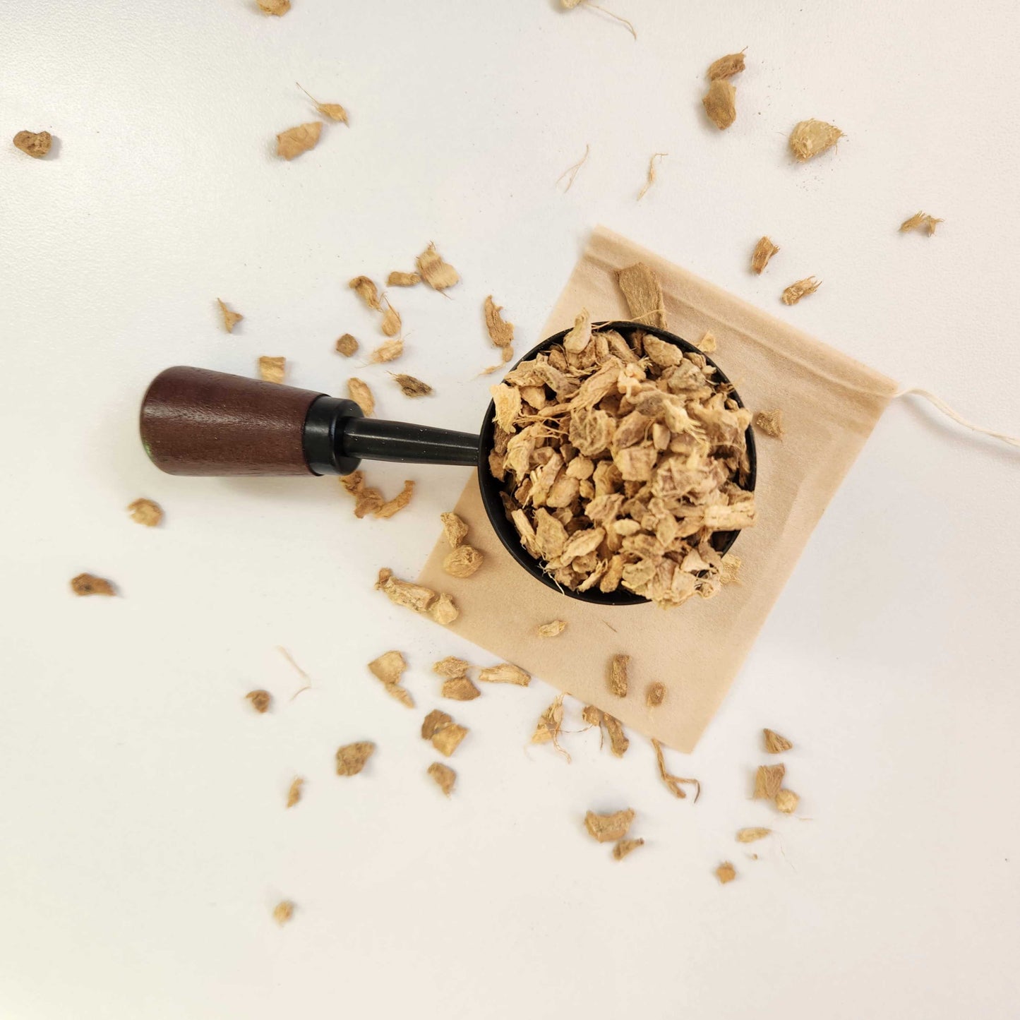 Monimo biodegradable and home compostable eco-friendly teabag pictured with ginger root herbal tea.