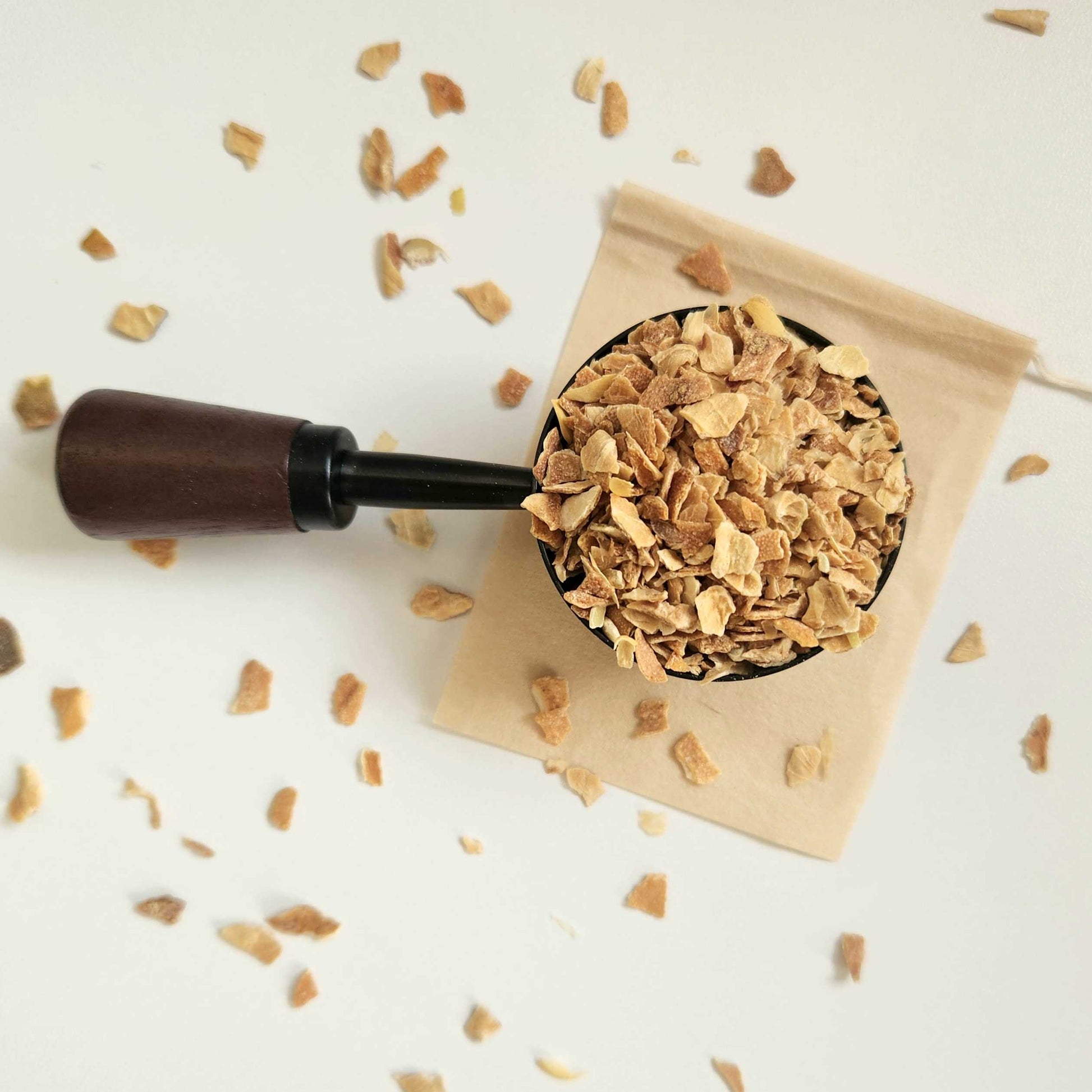 Monimo biodegradable and home compostable eco-friendly teabag pictured with Lemon Peel tea.