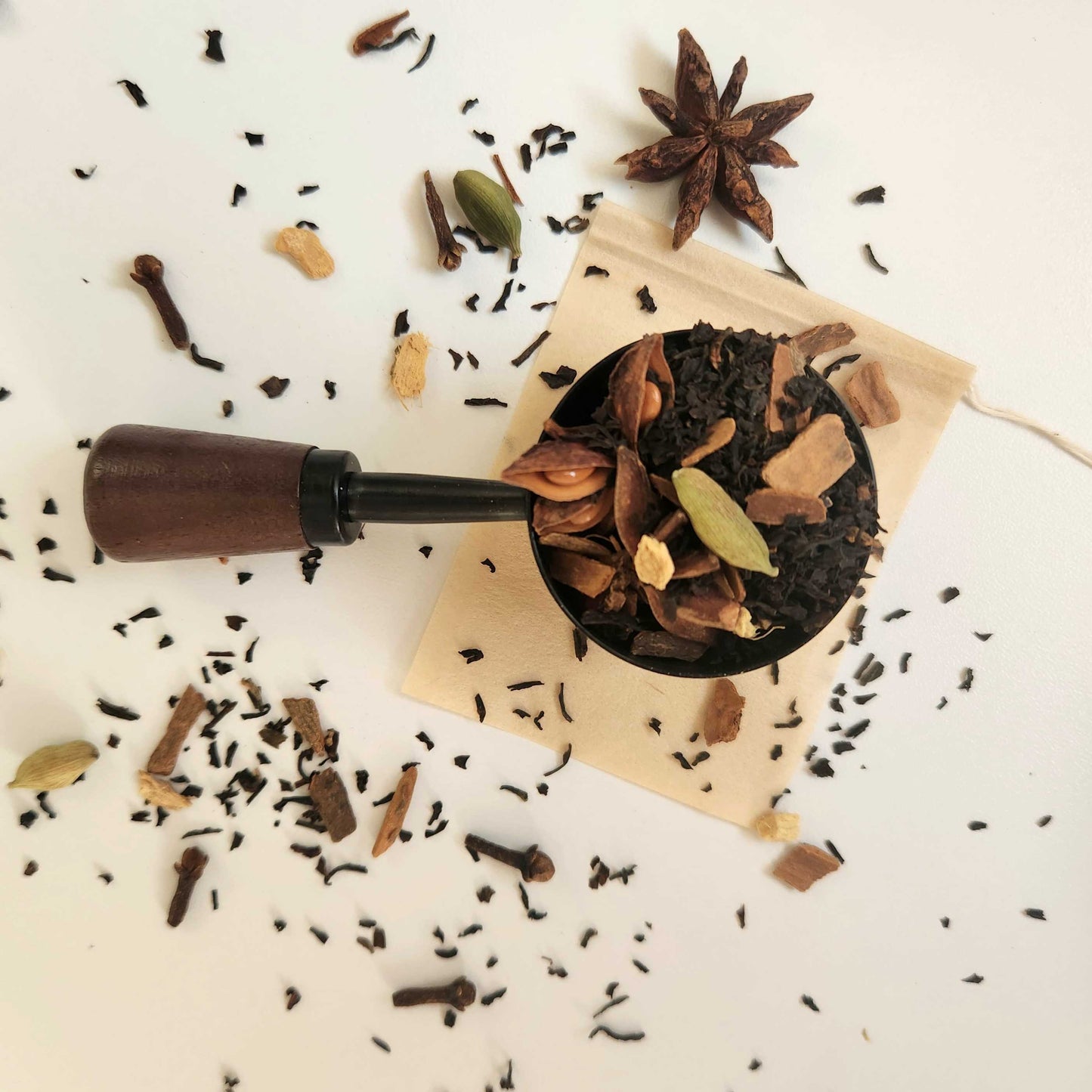 Monimo biodegradable and home compostable eco-friendly teabag pictured with Masala Chai tea leaves.