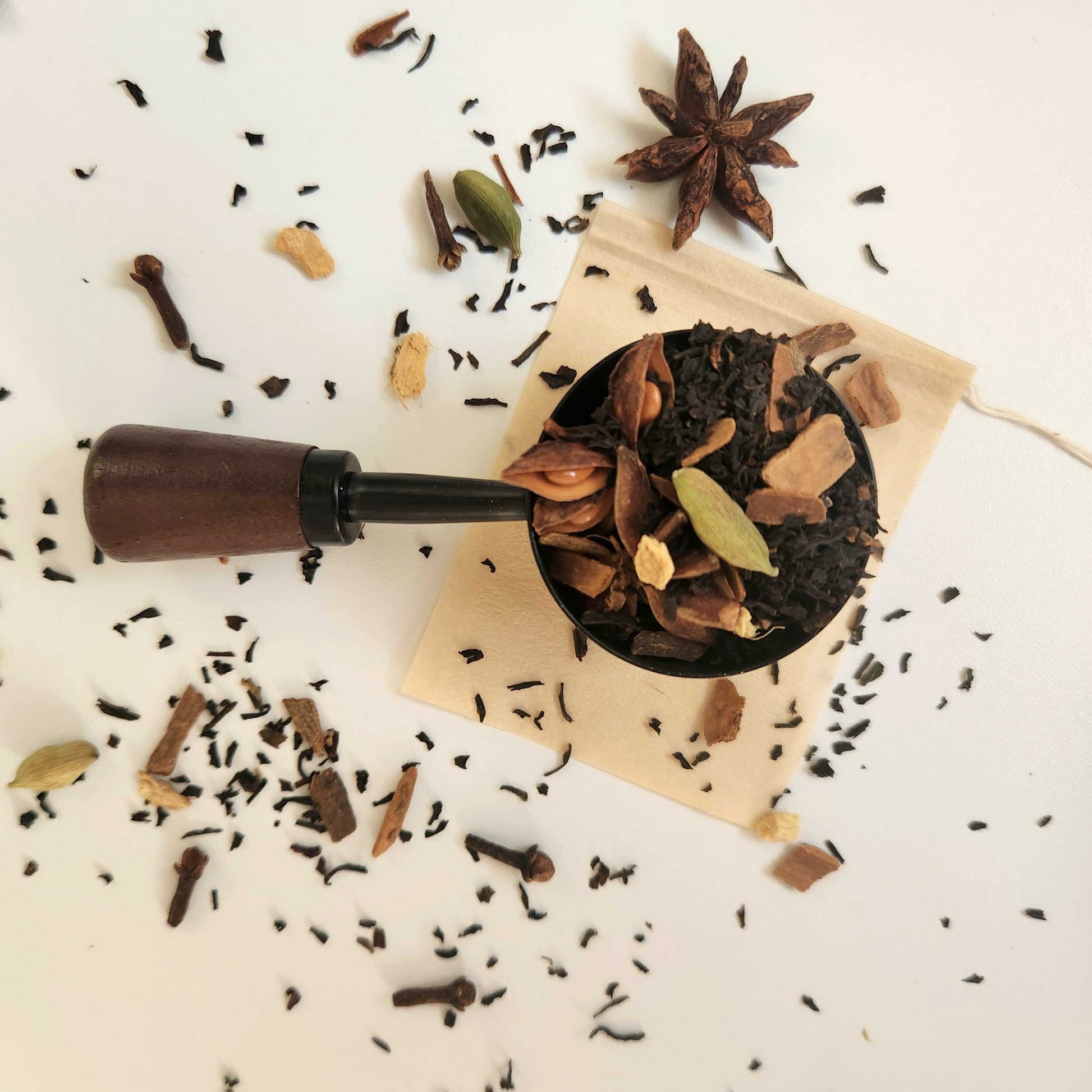 Monimo biodegradable and home compostable eco-friendly teabag pictured with Masala Chai tea leaves.